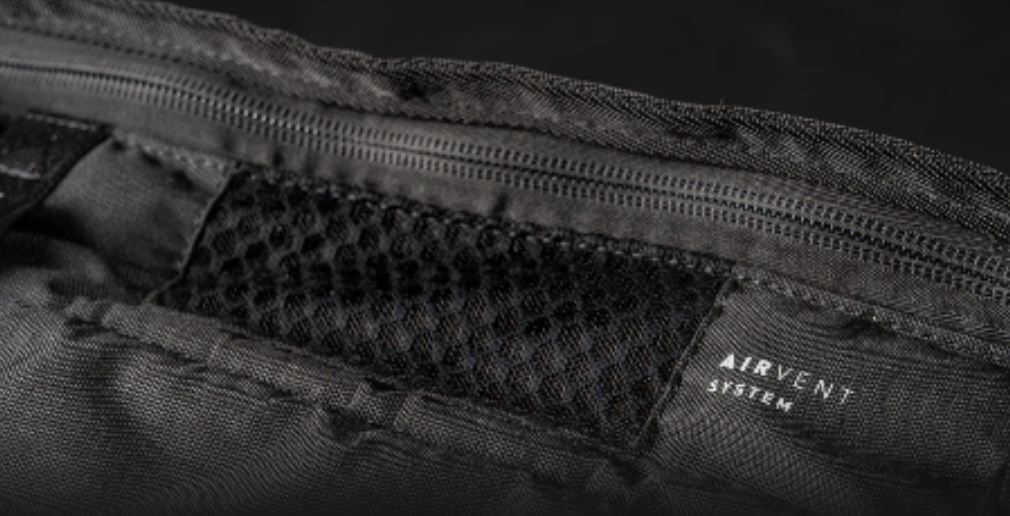 Close-up of a mesh vent panel on a black board bag marked Airvent System