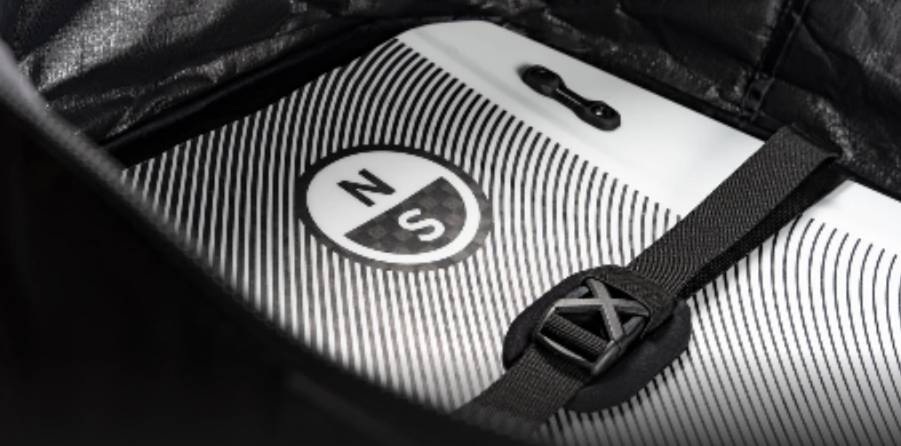 White board with a circular logo held inside a bag by a padded internal strap